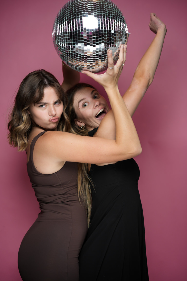 girls playing with disco ball self portrait